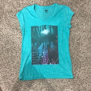 Green t shirt with design on it